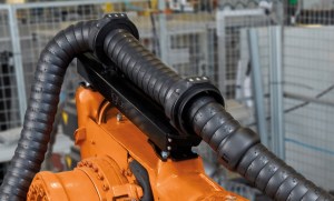 New igus retraction system for energy chains ensures fail-safe operation of robots article image