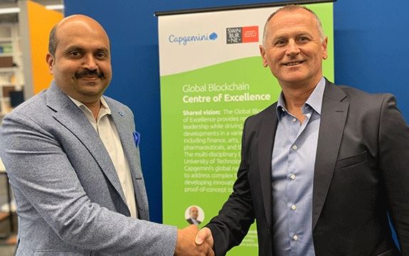 Sudhir-and-Aleks-handshake-landscape